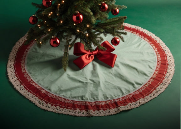 Decorated Christmas tree with a white faux fur skirt underneath