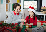Personalized Christmas ornaments displayed on a decorated Christmas tree