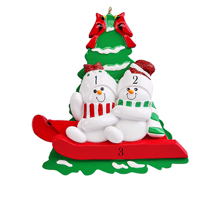 Snowmen on a red Sled